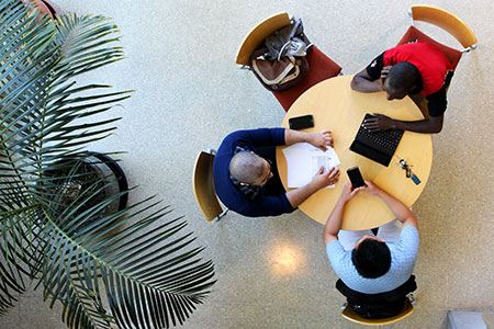 Group studying at table from above
