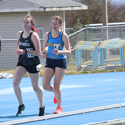 Lady sasquatch running distance race on the track 
