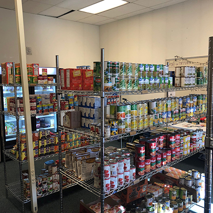 SFCC Food Pantry showing stacks of canned goods