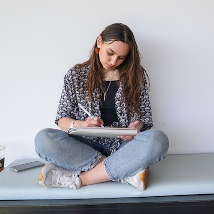 Innana McCartney draws on a tablet at Spokane Falls Community College