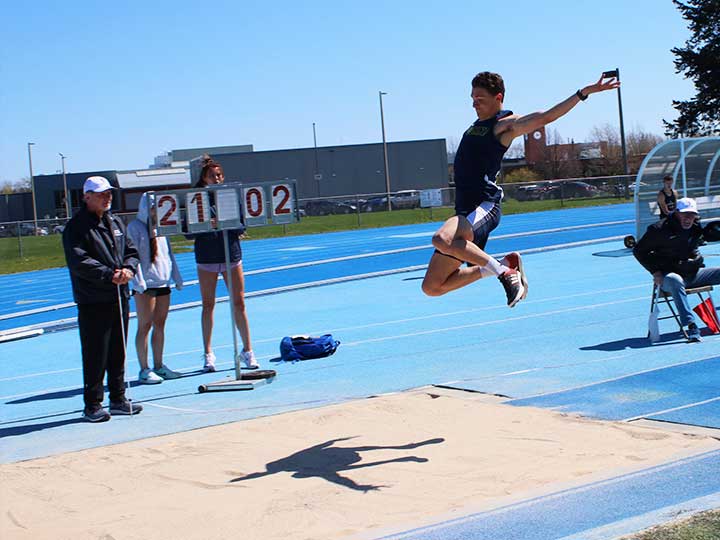 Men's track and field long jump midair