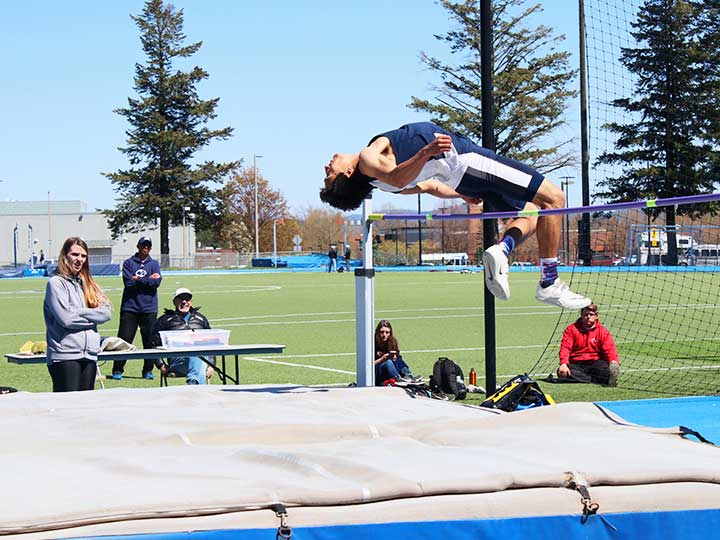Men's Track and Field high jump midair