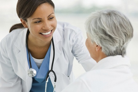 Woman with stethoscope helping patient