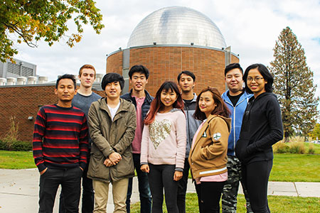 Group of International Students standing outside of SFCC’s planetarium. 